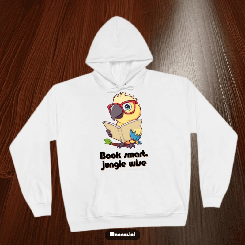 Funny Macaw Hoodie: A wise macaw bird with glasses reads a large leaf, exuding scholarly charm.