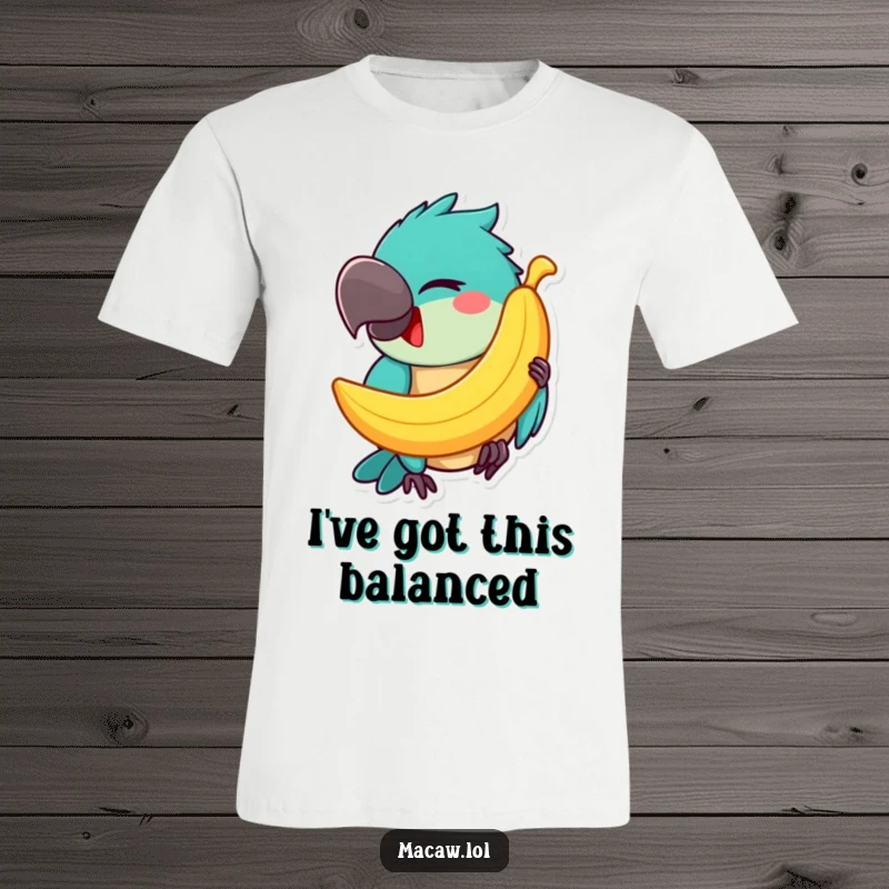 Funny Macaw T-Shirt: A happy macaw winks mischievously while balancing a banana on its beak, showcasing a funny and charming design.
